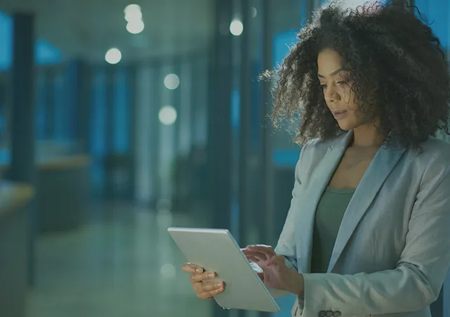 A recruiter reviewing data on a tablet